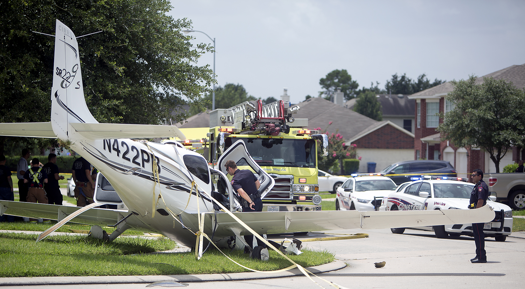Parachuteequipped plane lands safely in suburban neighborhood