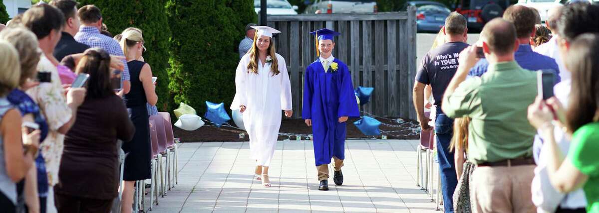 Devin Alward and Megan Godfrey show the way on the procession for Sherman School's eighth-grade graduation ceremony, June 19, 2015