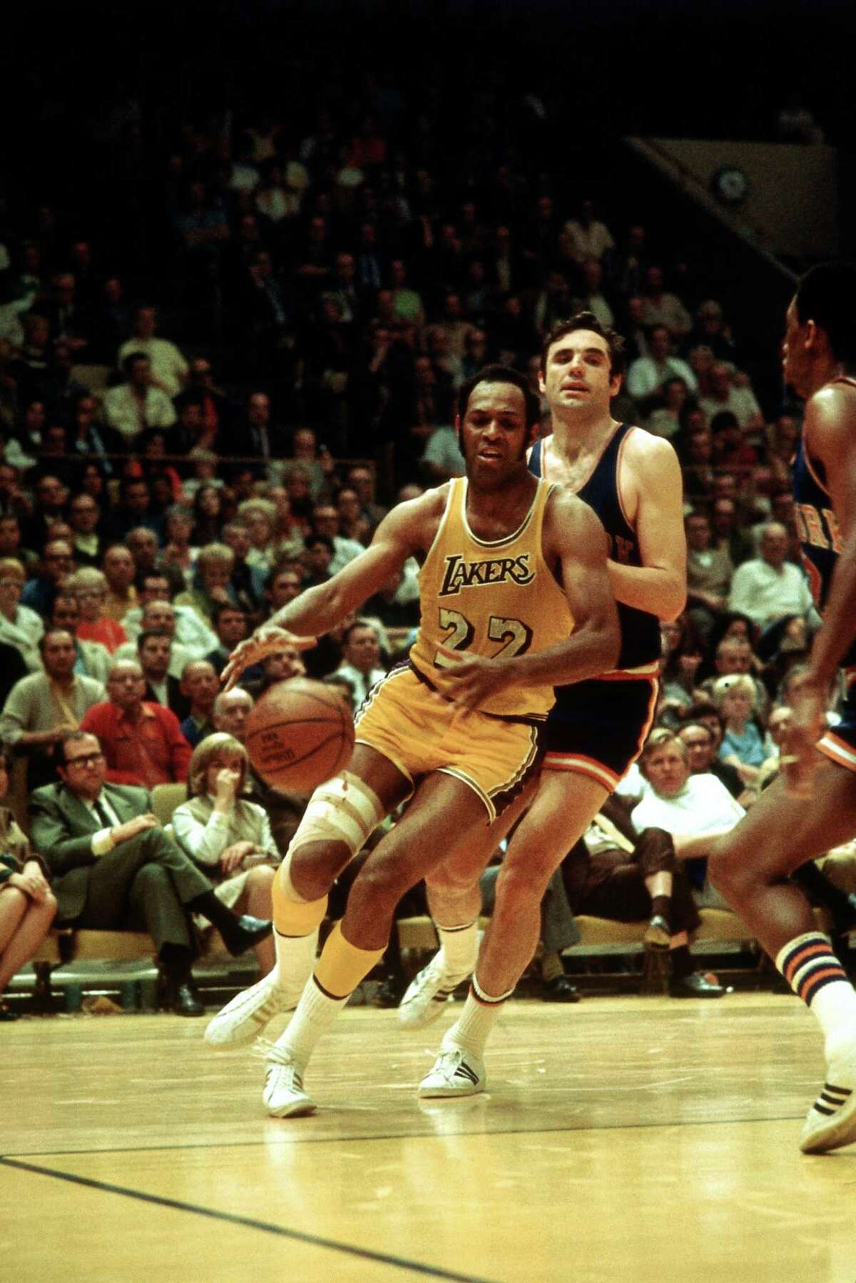 Elgin Baylor of the Los Angeles Lakers drives against the New York Knicks.