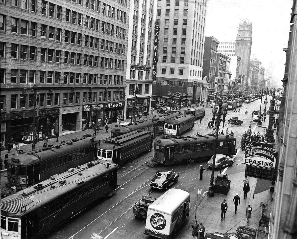 1940s: Streetcars pass each other on Market Street at Geary. Called "the Roar of the Four," the streetcars were packed tightly when Muni competed with private transit companies.