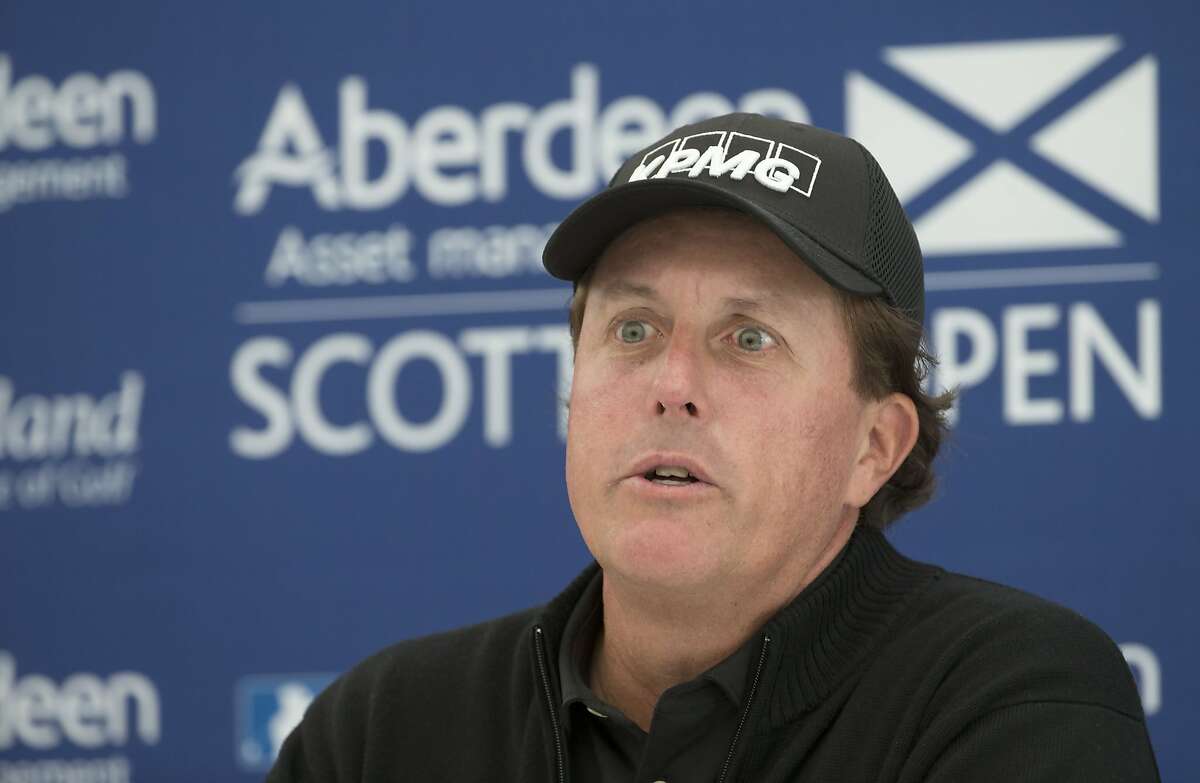 US golfer Phil Mickelson answers questions from the media during a preview day ahead of the Scottish Open at Gullane Golf Club, Gullane Scotland Wednesday July 8, 2015. Five-time major champion Phil Mickelson has refused to comment on allegations linking him to an illegal gambling operation, saying he had got used to being an “object to be discussed.” Speaking Wednesday ahead of the Scottish Open, Mickelson says “the fact is I'm comfortable enough with who I am as a person that I don't feel I need to comment on every little report that comes out.” (Kenny Smith/PA via AP) UNITED KINGDOM OUT NO SALES NO ARCHIVE