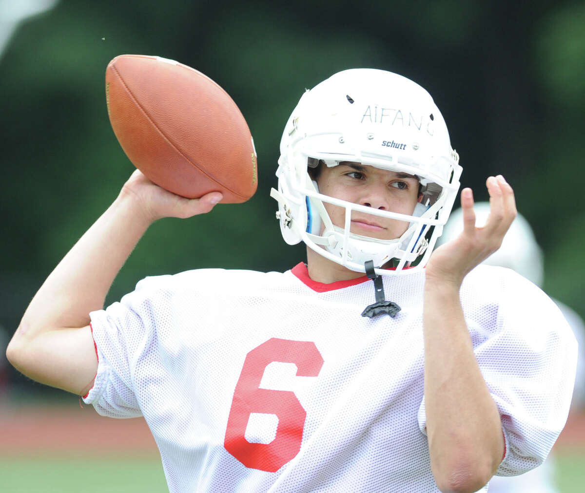 Red team quarterback Frank Alfano throws during the annual Red vs. White Greenwich High School football scrimmage at the school in Greenwich, Conn., Friday, June 12, 2015.