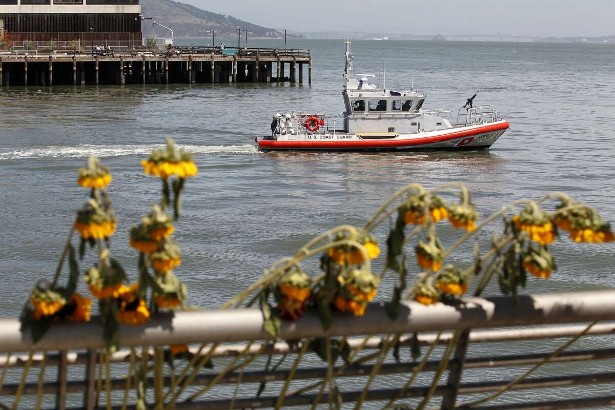A U.S. Coast Guard boat patrols by Pier 14 following a vigil for Kathryn Steinle, Monday, July 6, 2015, on Pier 14 in San Francisco. Steinle was gunned down while out for an evening stroll at Pier 14 with her father and a family friend on Wednesday, July 1. (AP Photo/Beck Diefenbach)