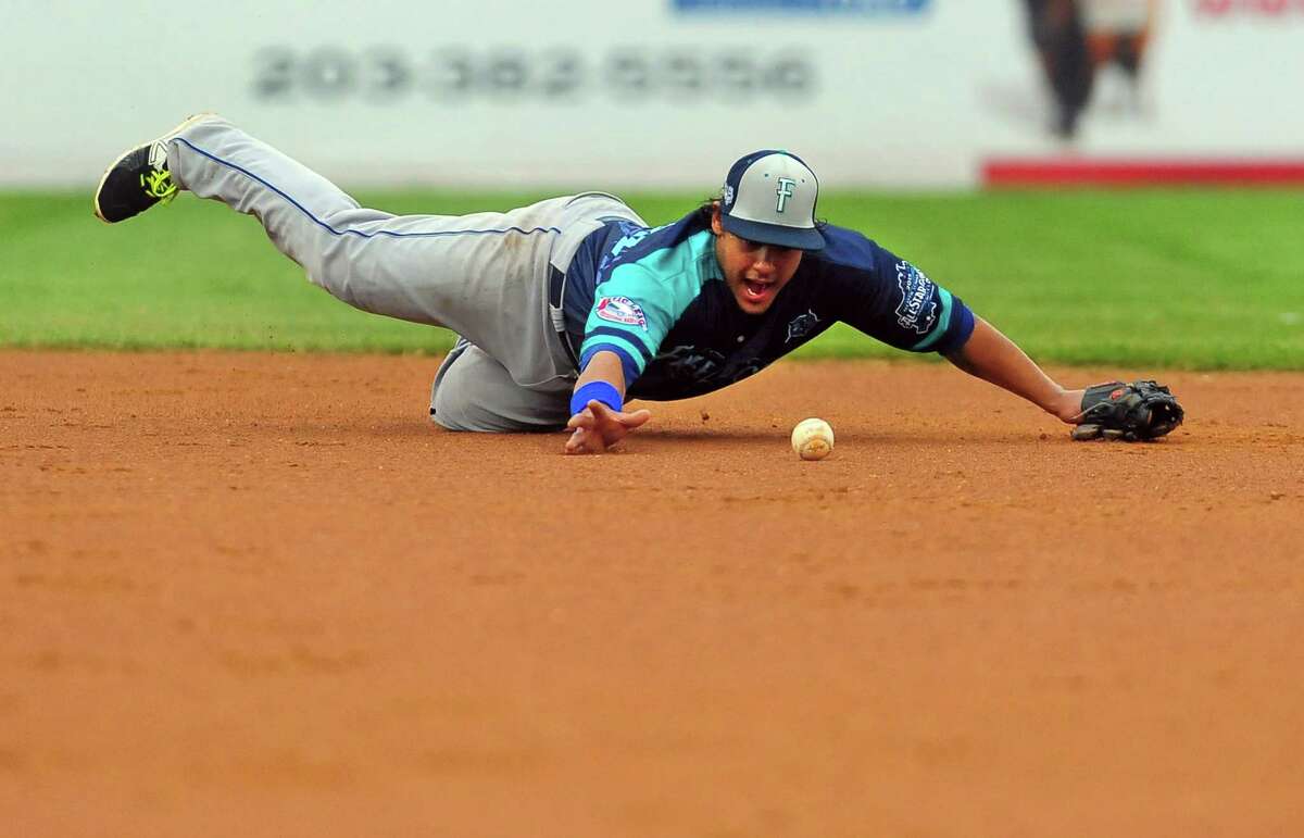 Freedom's second baseman Delwyn Young tries to recover the ball during Atlantic League All-Star Game action at the Ballpark at Harbor Yard in Bridgeport, Conn., on Wednesday July 8, 2015.