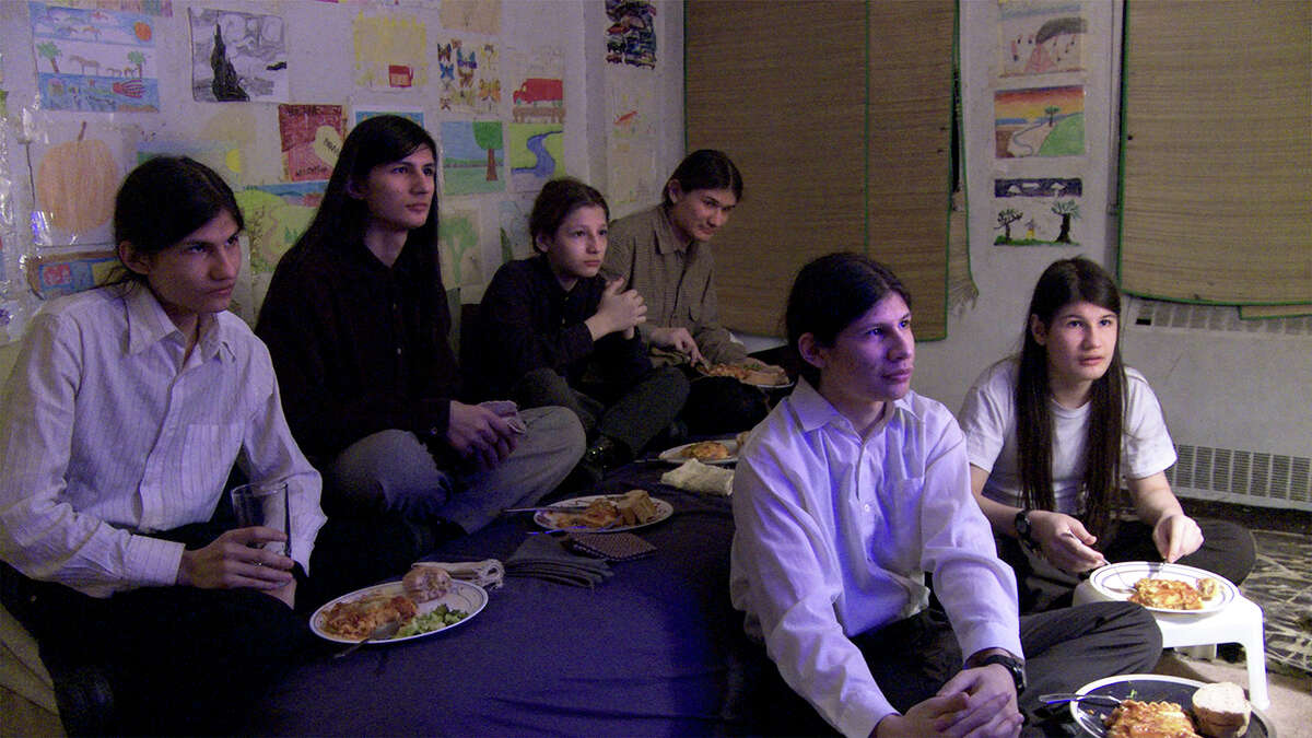 This photo provided by courtesy of Magnolia Pictures shows, from left, Narayana Angulo, Govinda Angulo, Jagadisa Angulo (Glenn Angulo), Bhagavan Angulo, Mukunda Angulo and Krsna Angulo (Eddie Angulo), in the documentary film, "The Wolfpack," a Magnolia Pictures release. The movie opened in U.S. theaters on June 12, 2015. (Courtesy Magnolia Pictures via AP)
