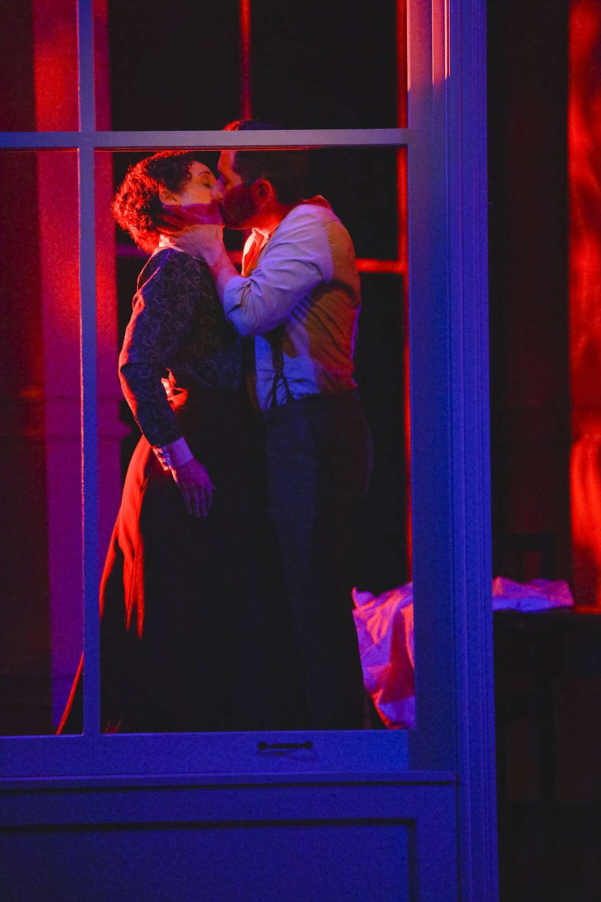 TheatreWorks_Triangle 17_KevinBerne: Sarah (Megan McGinnis) and Vincenzo (Zachary Prince) share a final kiss in TheatreWorks Silicon Valley's World Premiere of Triangle playing July 8 - August 2 at the Lucie Stern Theatre in Palo Alto.