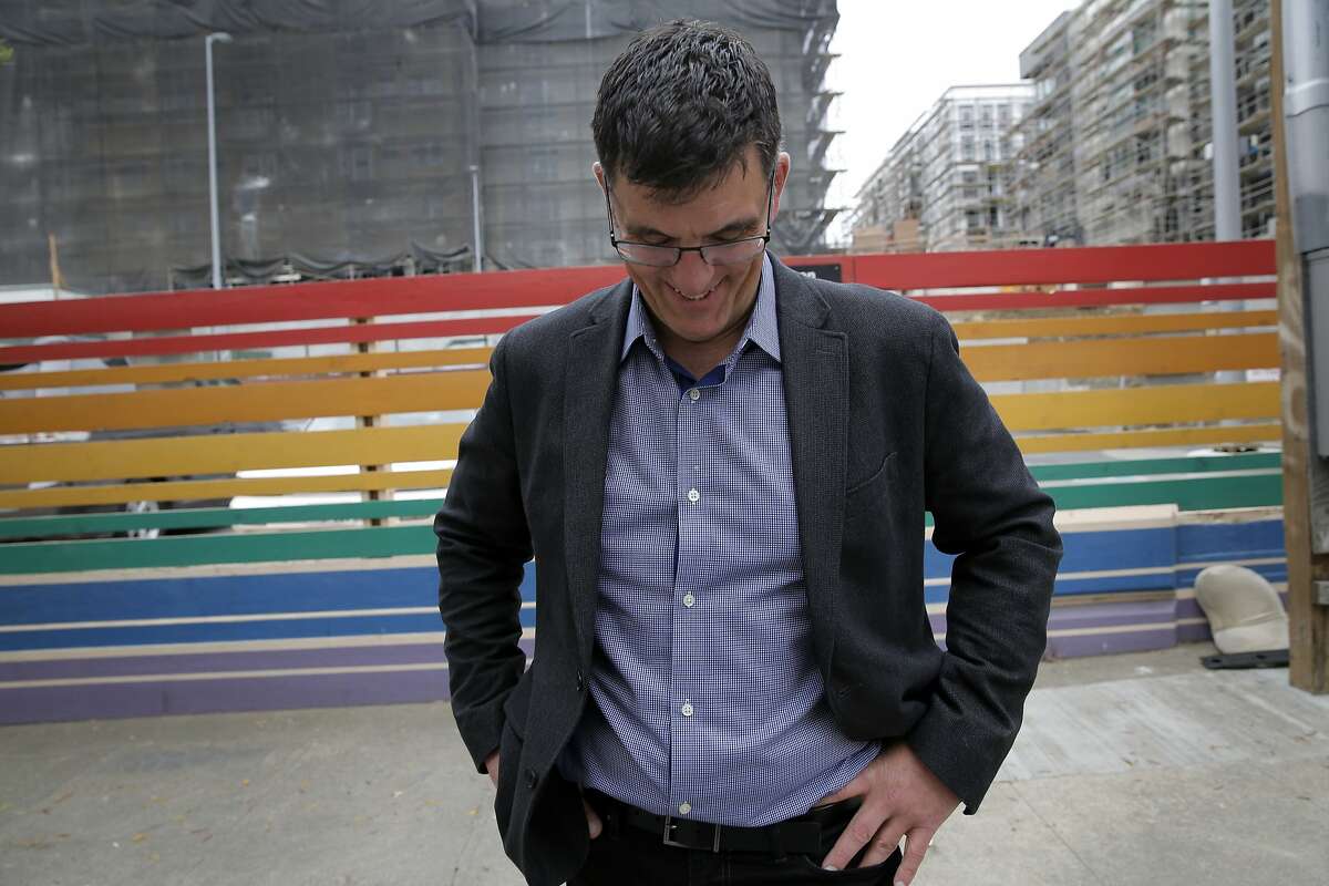 Seth Kilbourn, executive director of Openhouse, laughs from outside the location of a future housing development that will have units targeting low-income LGBT seniors in the Castro neighborhood of San Francisco, California, on Thursday, July 9, 2015.