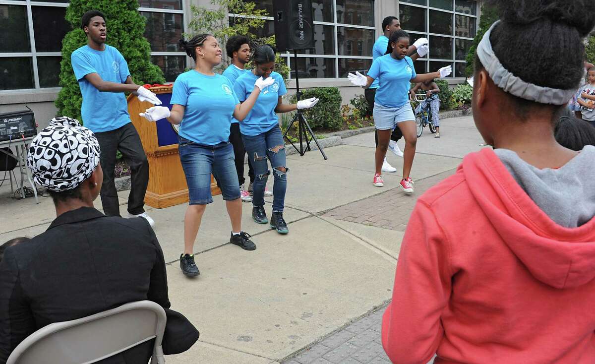 A group from the Sweet Pilgrim Missionary Baptist Church perform a routine during a sidewalk fair to celebrate the new Youth Opportunity Office at 382 Clinton Ave. on Thursday, July 9, 2015 in Albany, N.Y. (Lori Van Buren / Times Union)