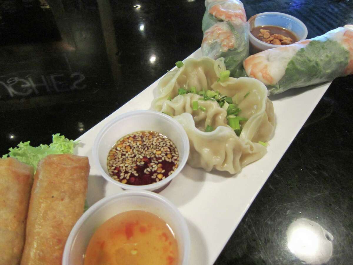 At Hughie's Tavern & Vietnamese Grille, the BaTrio is $11, and it allows you to pick any three of 10 appetizers. This plate has Vietnamese egg rolls, spring rolls and steamed dumplings.