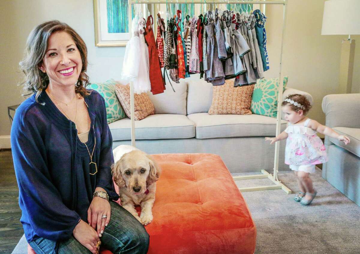 Esther Freedman with her 18-month old daughter Naomi at their home in Bellaire,Texas, Wednesday July 9, 2015. Freedman launched her line in 2012, selling from her website at cuteheads.com. (Billy Smith II / Houston Chronicle)