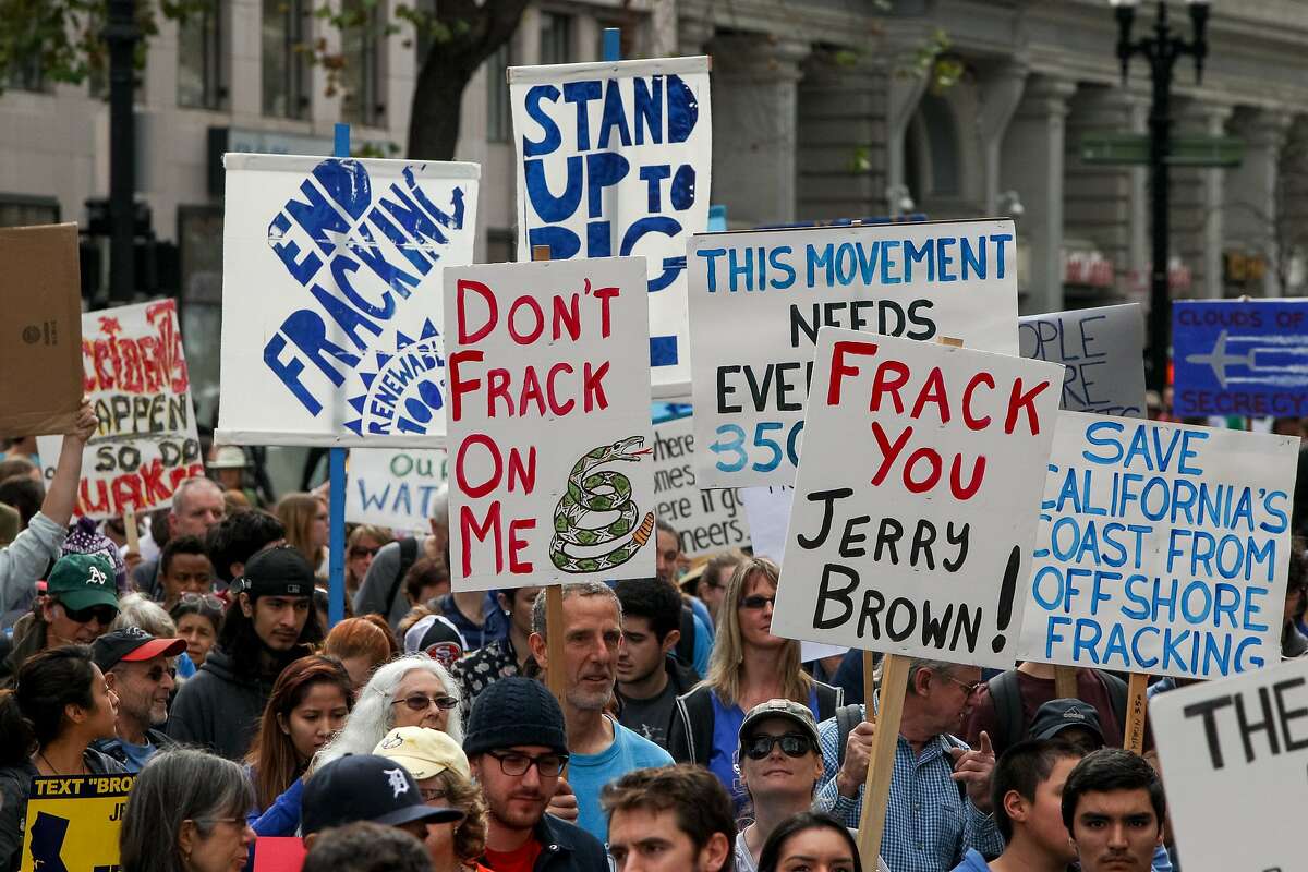 Protesters against fracking rallied at Frank H. Ogawa Plaza and marched for two miles to Lake Merritt Boulevard, Saturday, Feb. 7, 2015, in Oakland, Calif.