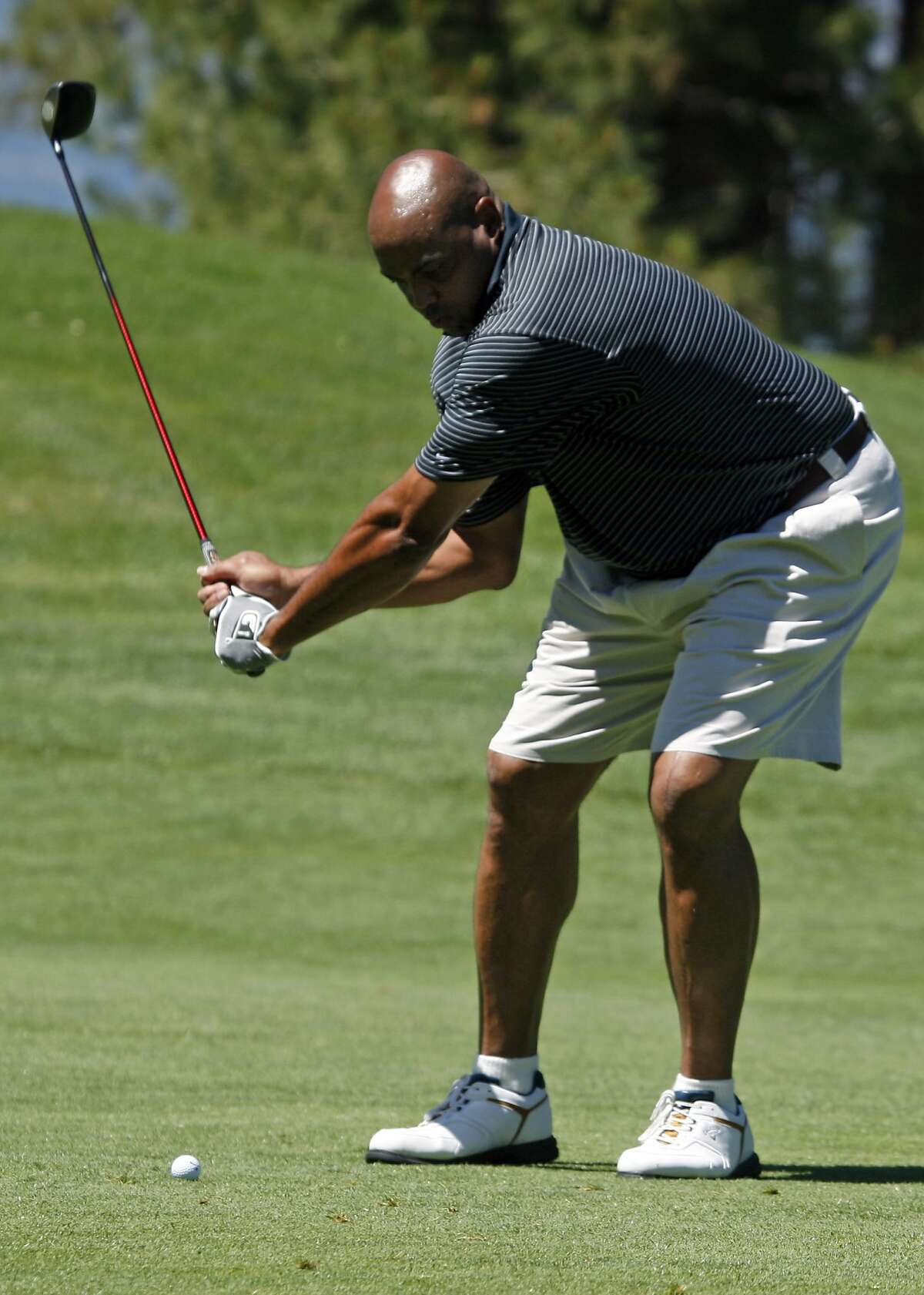 Charles Barkley, hits his second shot on the second hole during practice rounds at the 20th annual Celebrity Pro-Am American Century Championship at Edgewood Tahoe Golf Course. Thursday July 16, 2009