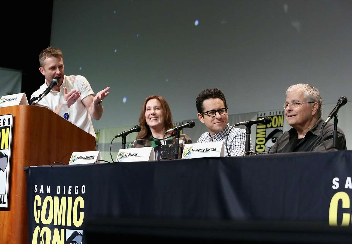 SAN DIEGO, CA - JULY 10: (L-R) Moderator Chris Hardwick, producer Kathleen Kennedy, director J.J. Abrams and screenwriter Lawrence Kasdan at the Hall H Panel for "Star Wars: The Force Awakens" during Comic-Con International 2015 at the San Diego Convention Center on July 10, 2015 in San Diego, California. (Photo by Jesse Grant/Getty Images for Disney)