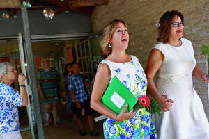 Area gay couples take part in free weddings at  First Unitarian Universalist Church of San Antonio