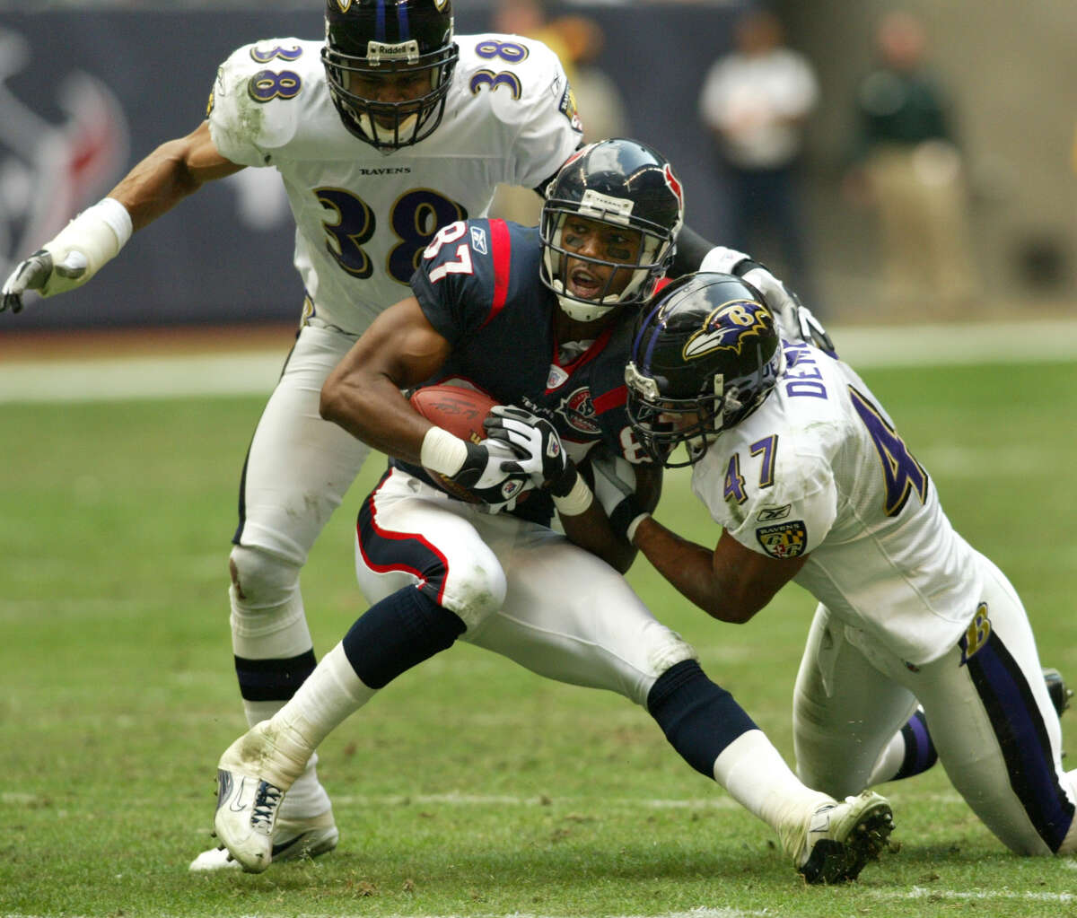 12/15/02--Baltimore Ravens safety Will Demps (#47) stops Houston Texans wide receiver JaJuan Dawson (#87) as Baltimore Ravens corner back James Trapp (#38) closes in during fourth quarter action Sunday afternoon, Dec. 15, 2002, at Reliant Stadium in Houston. The Ravens defeated the Texans 23-19. (digital photo by Kevin Fujii/Chronicle)