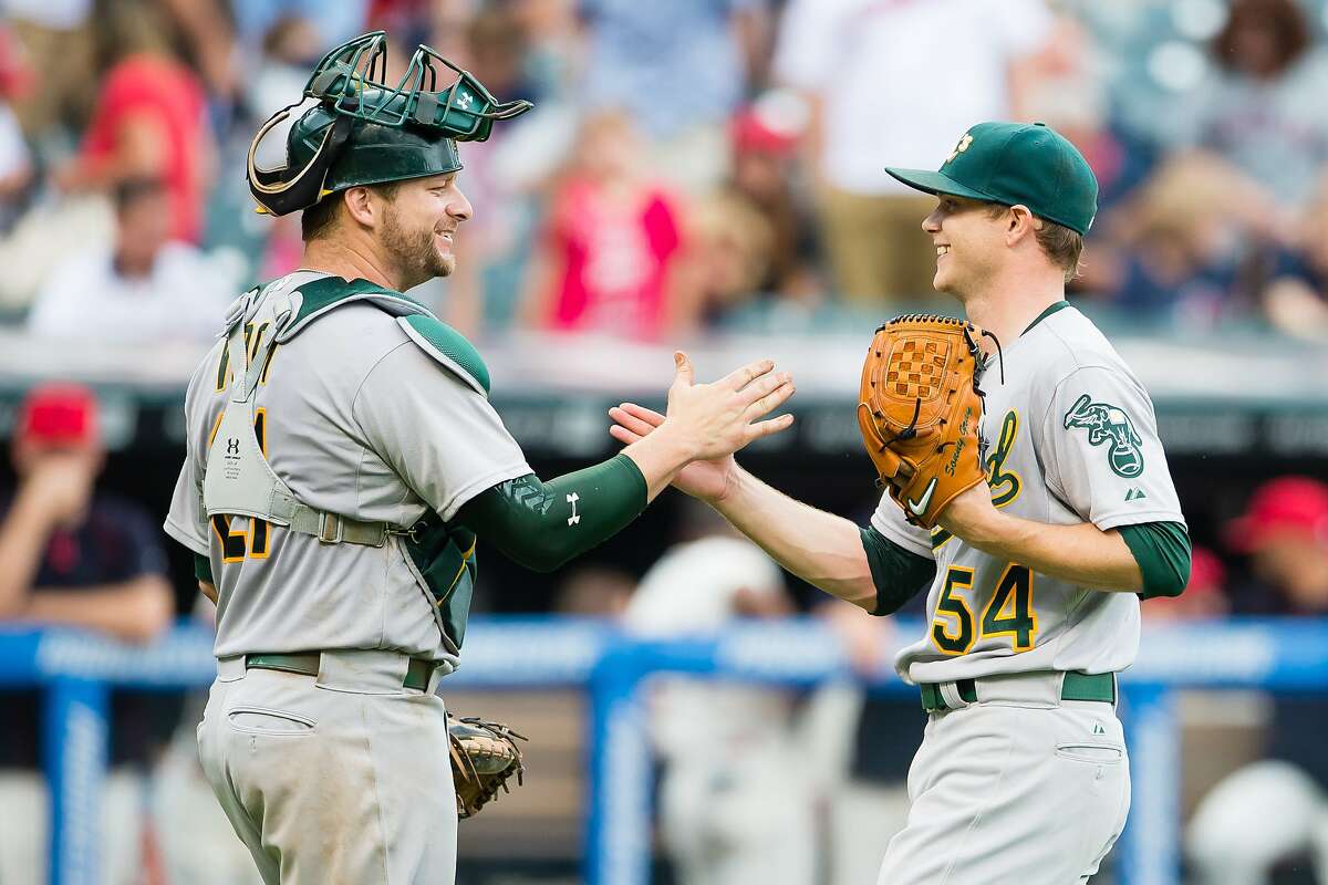 CLEVELAND, OH - JULY 12: Catcher Stephen Vogt #21 celebrates with starting pitcher Sonny Gray #54 of the Oakland Athletics after a win over the Cleveland Indians at Progressive Field on July 12, 2015 in Cleveland, Ohio. The Athletics defeated the Indians 2-0. (Photo by Jason Miller/Getty Images)