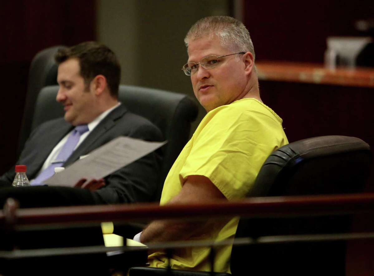Former Katy football star David Temple, right, during a hearing at the Harris County Criminal Courthouse Friday, Dec. 19, 2014, in Houston, Texas. Temple is in court for a hearing to flesh out evidence that his attorneys say will exonerate him of the 1999 murder of his wife, beloved high school teacher Belinda Temple. ( Gary Coronado / Houston Chronicle )