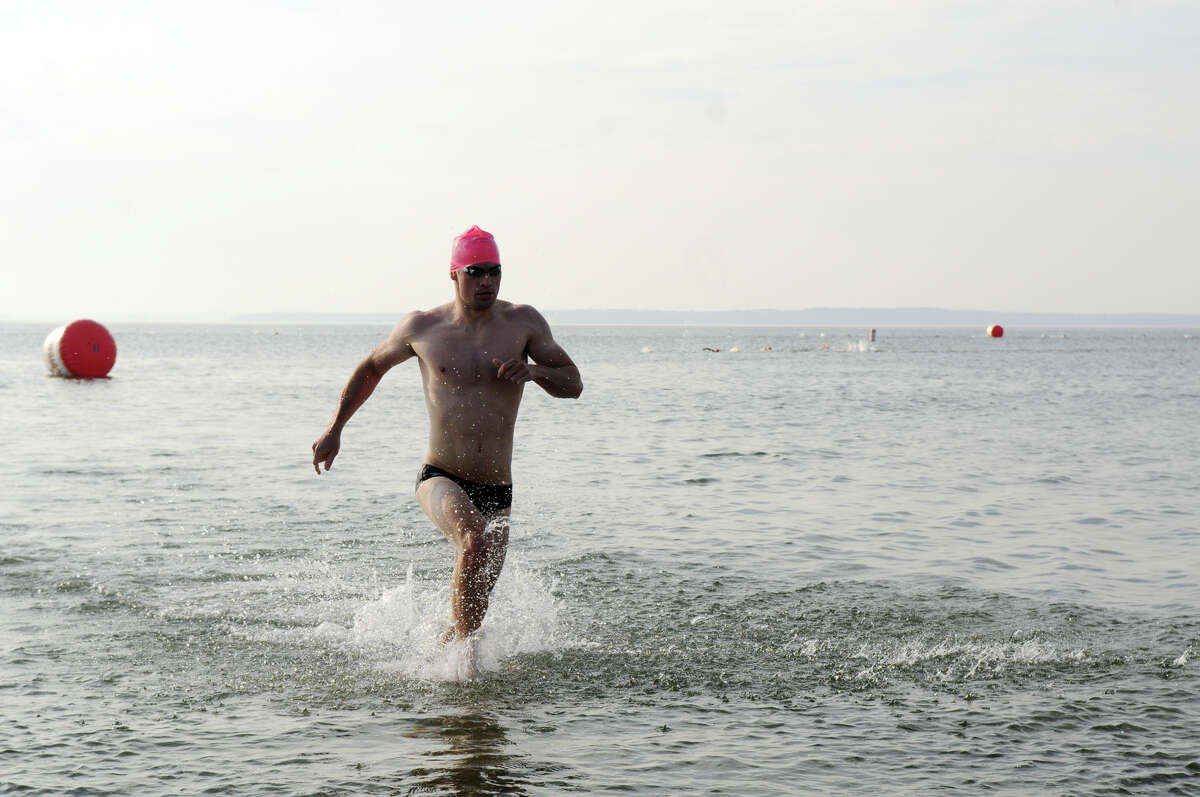Ansel Hillmer finishes fourth during the One Mile Greenwich Point Swim at Tod's Point in Greenwich, Conn., July 11, 2015.