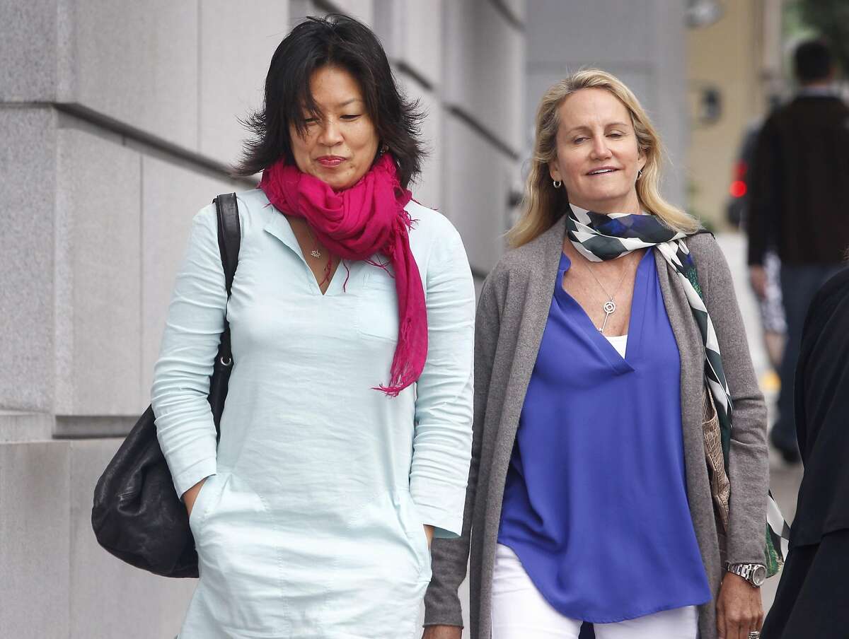 Mimi Lee (left) arrives at San Francisco Superior Court with an unidentified woman for the second day of testimony in San Francisco, Calif. on Tuesday, July 14, 2015 in her case against ex-husband Stephen Findley involving custody of their frozen embryos.
