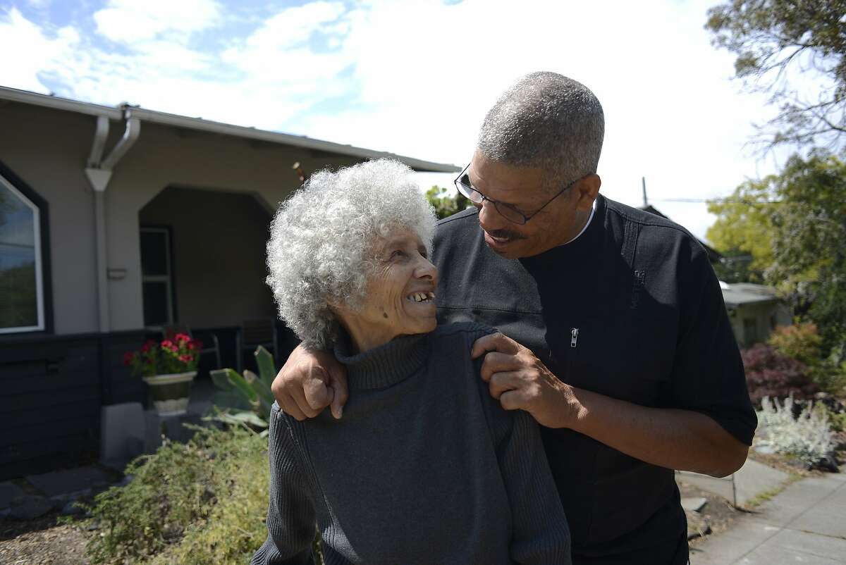 Doug Harris (right) and his mother Gloria Nelson (left) share a moment together at their home in Berkeley, California, on Friday, July 10, 2015.