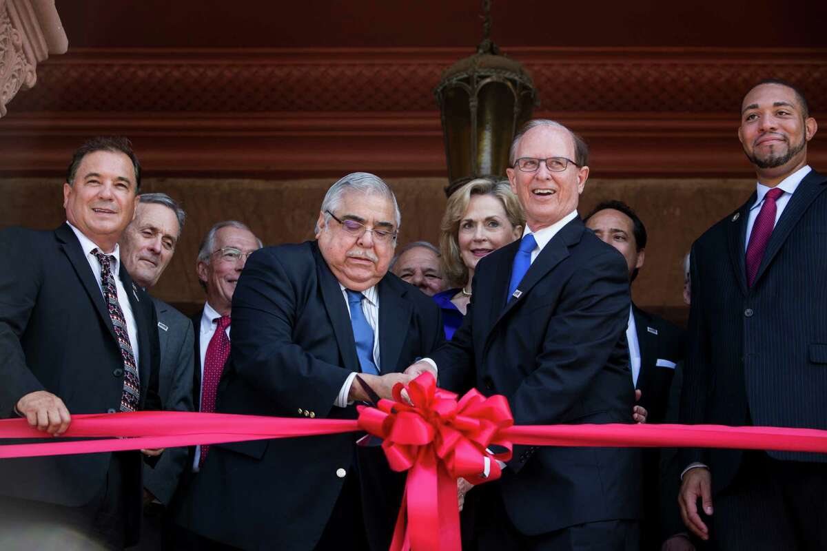 Commissioner Paul Elizondo and County Judge Nelson Wolff cut the ribbon during a rededication ceremony for the Bexar County Courthouse after the removal of the 1963 and 1970 Gondeck additions in San Antonio, Texas on July 14, 2015. The renovation restored the Bexar County Courthouse back to its original historic façade.