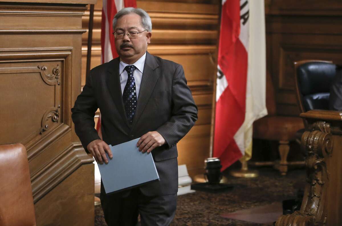 Mayor Ed Lee exits the chamber after comments to the board as the San Francisco Board of Supervisors prepared to vote on competing measures to regulate Airbnb and other short-term rental services in San Francisco, Calif., on Tues. July 14, 2015.