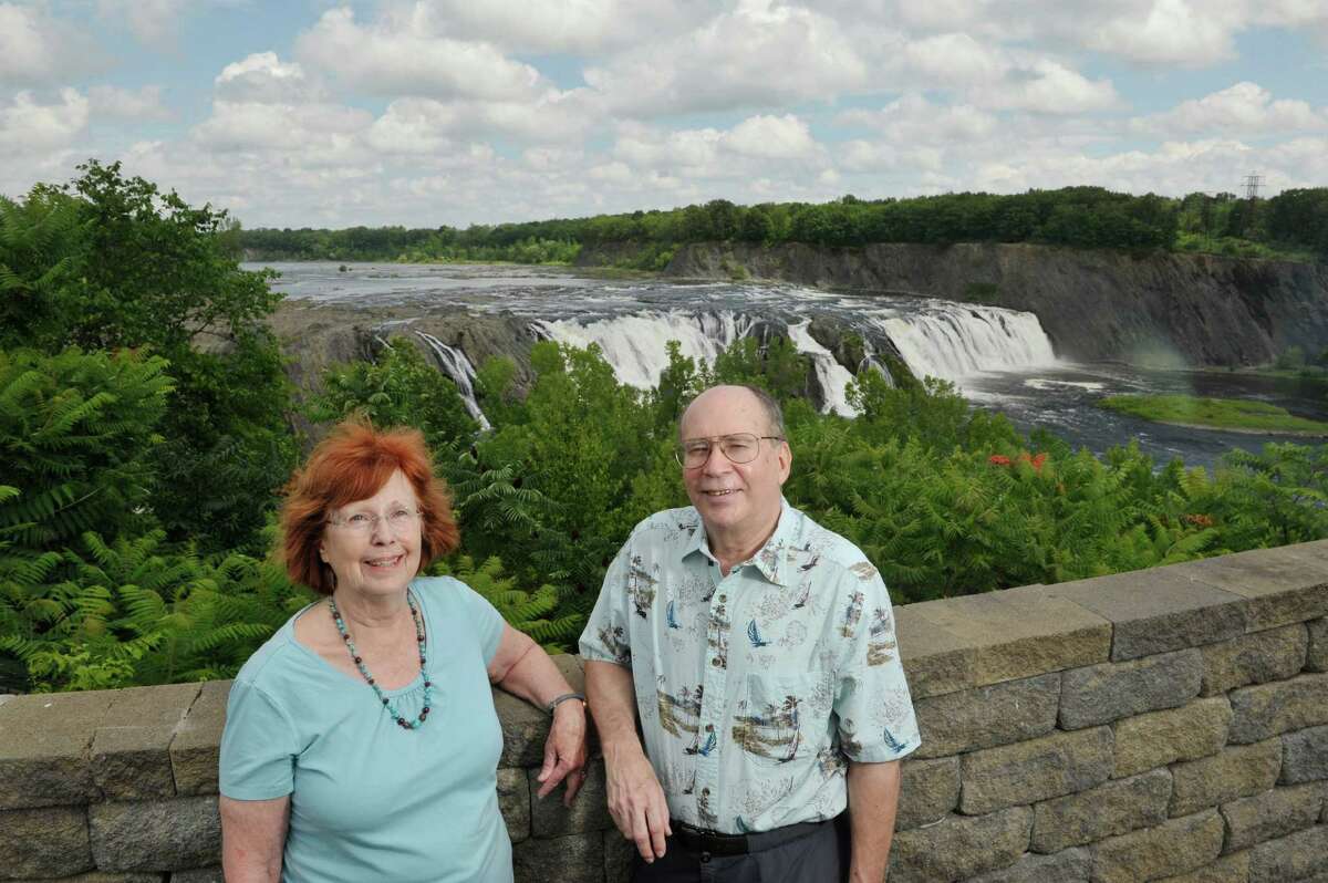 Barb Delaney and her husband Russell Dunn pose for a photograph at the Cohoes Falls on Tuesday, July 14, 2015, in Cohoes, N.Y. The two have collaborated on several books. (Paul Buckowski / Times Union)
