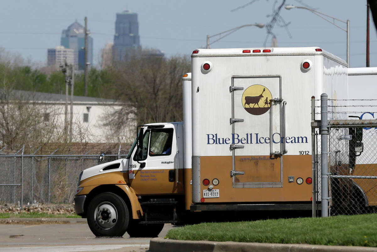 Blue Bell delivery trucks are parked at the creamery in Kansas City, Kansas. The company announced that an investment by prominent Texas businessman Sid Bass will "ensure" the return of its ice cream products to the market.