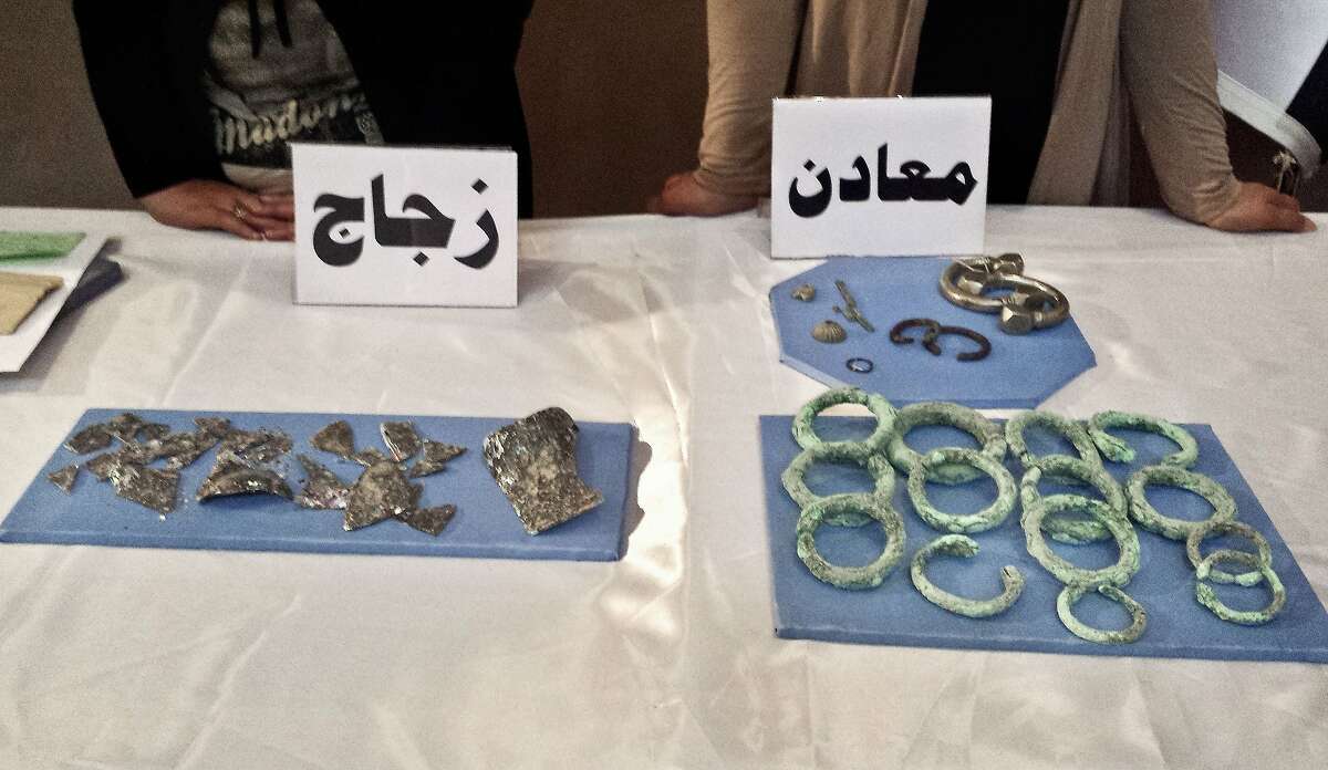 Recovered antiquities are displayed at the Iraqi National Museum in Baghdad, Iraq, Wednesday, July 15, 2015. Nearly 500 artifacts recovered by U.S. Army commandos during a recent raid in Syria targeting the Islamic State group were displayed at the Baghdad National Museum Wednesday after being returned to Iraq.