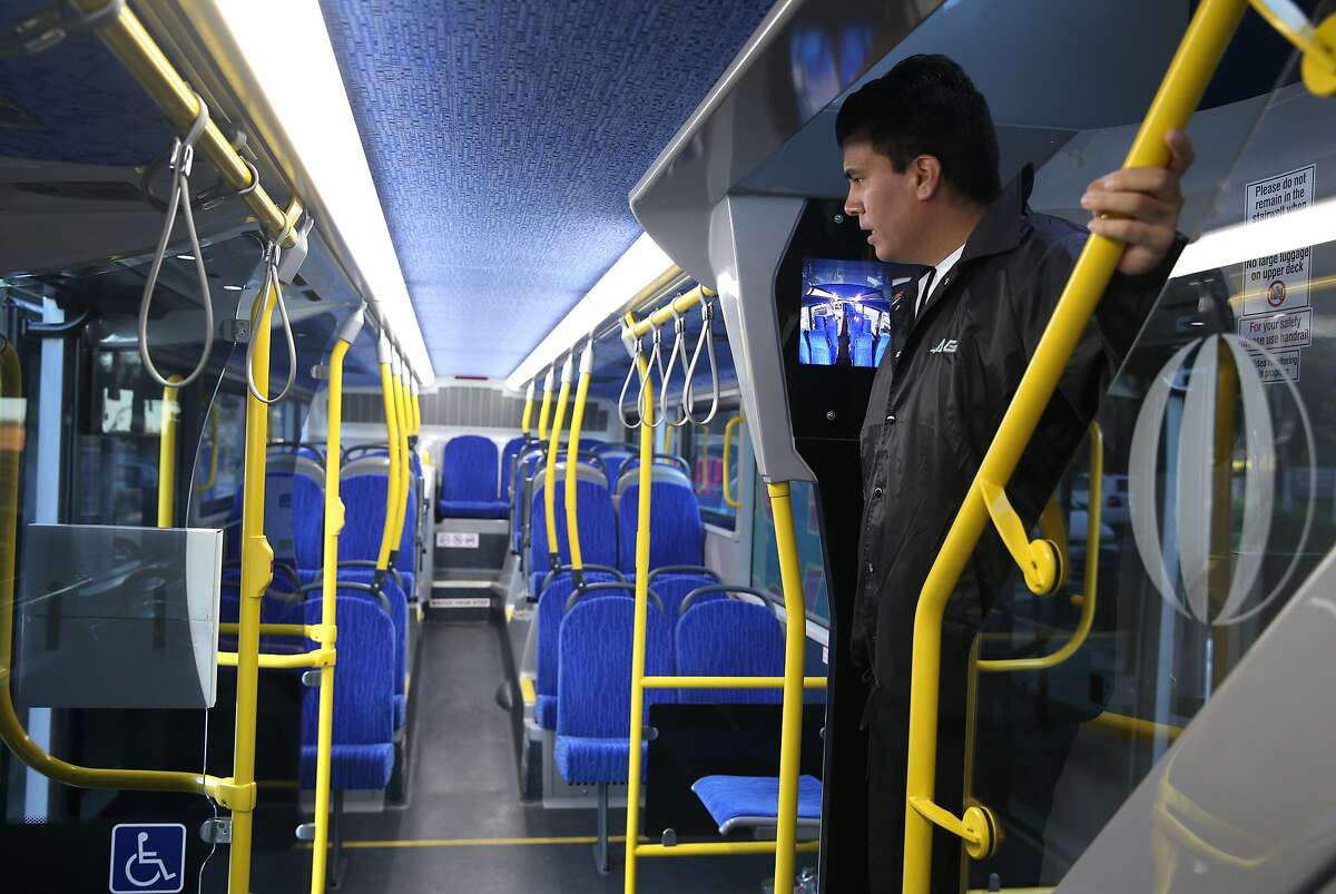 AC Transit ambassador Orlando Perez makes sure passengers grabbed their belongings from the lower deck after a commuter run to Stanford, Calif. on Tuesday, Feb. 24, 2015. AC Transit tested the 80-seat, double- decker buses and has decided to buy a number of them.
