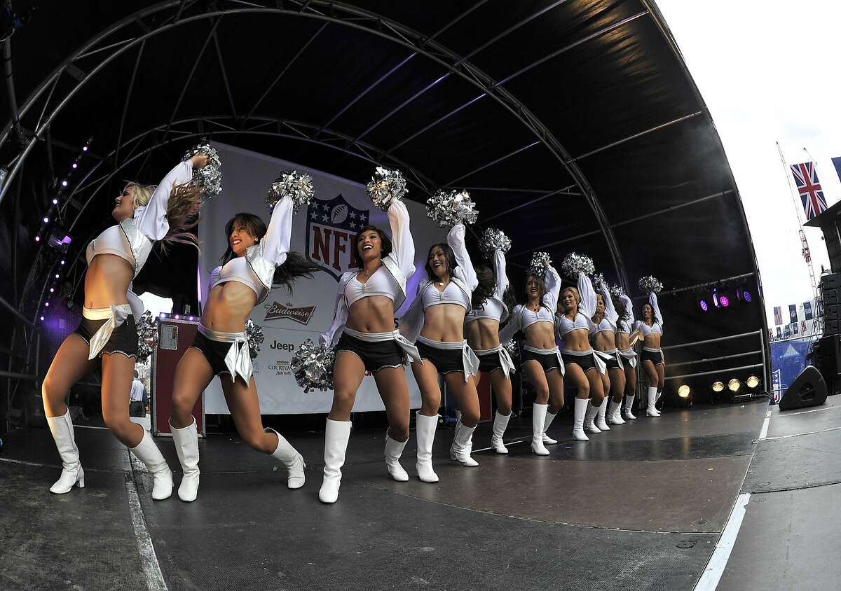 Oakland Raiders Cheerleaders make an appearance on stage. NFL on Regent St. Regent St. London is closed to traffic to hold a fan event The Oakland Raiders and the Miami Dolphins play in the NFL International Series at Wembley Stadium in London on Sunday, Sept 28. 27/09/14, photo: Sean Ryan /NFL mobile: 07971 400 939 Address: 11 Botley Road, Park Gate, Southampton Hants S031 1AH UK tel +44 (0)1489 579109