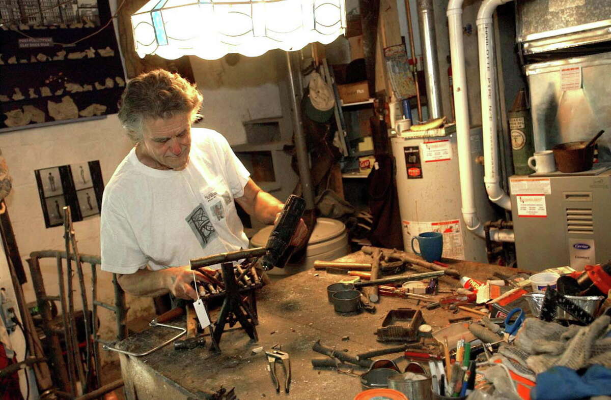 Paul Weinman makes one of his miniature chairs in his garage Monday, June 27, 2005, in Albany, N.Y. (Steve Jacobs/Times Union)