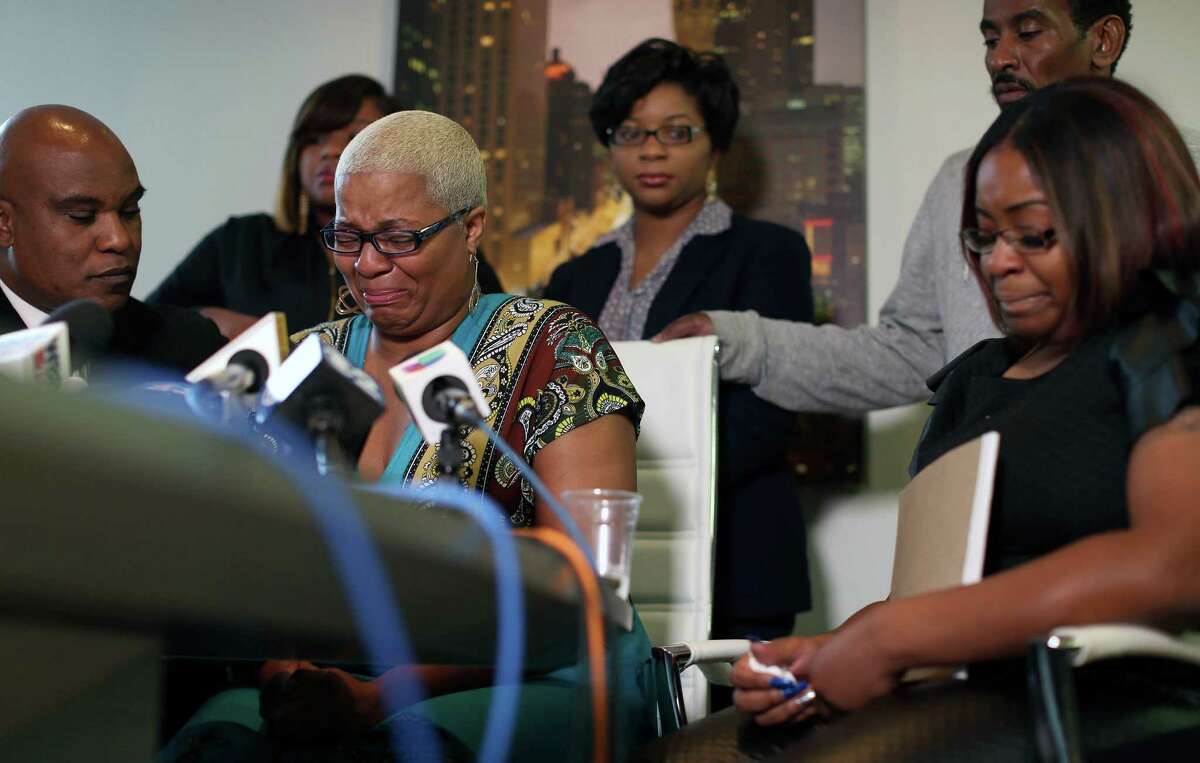 Shavon Bland, back left, Sharon Cooper, back center, and Sierra Cole, right, Sandra Bland's oldest sister Shante Needham, center, becomes emotional as she tries to answer a question from a reporter, during news conference about their sister's death, Thursday, July 16, 2015 in Chicago. Their attorney Cannon Lambert, left, and their uncle Paul Needham, right, were also present. Sandra Bland, a 28-year-old woman who authorities say hanged herself in a Texas jail after her arrest for allegedly kicking an officer following a traffic stop gave no indication she was in such an emotional state that she would kill herself, her sister said Thursday. (Abel Uribe/Chicago Tribune via AP) MANDATORY CREDIT CHICAGO TRIBUNE; CHICAGO SUN-TIMES OUT; DAILY HERALD OUT; NORTHWEST HERALD OUT; THE HERALD-NEWS OUT; DAILY CHRONICLE OUT; THE TIMES OF NORTHWEST INDIANA OUT; TV OUT; MAGS OUT; NO SALES