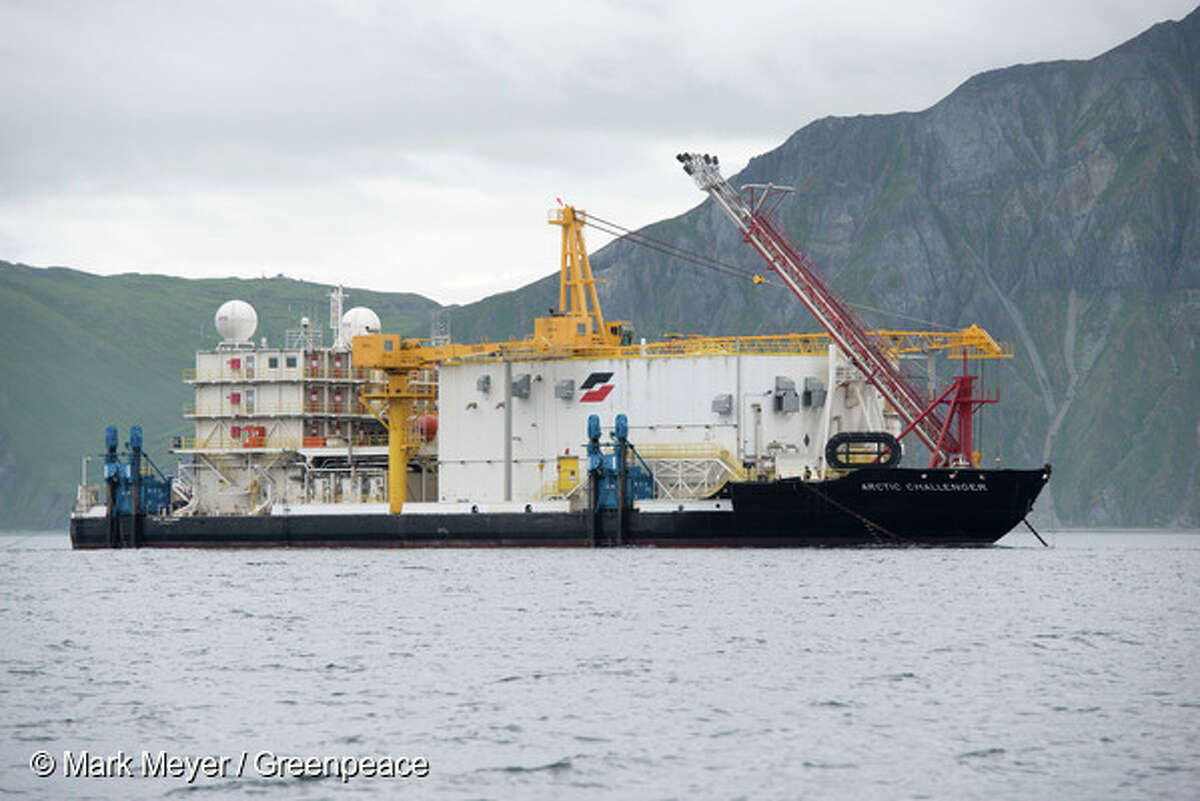 The Arctic Challenger, one of 29 vessels – and two icebreakers – that will head to the Chukchi Sea this summer in support of Shell’s planned arctic drilling operations, sits at anchor in Unalaska's Dutch Harbor. Photo by Mark Meyer/Greenpeace