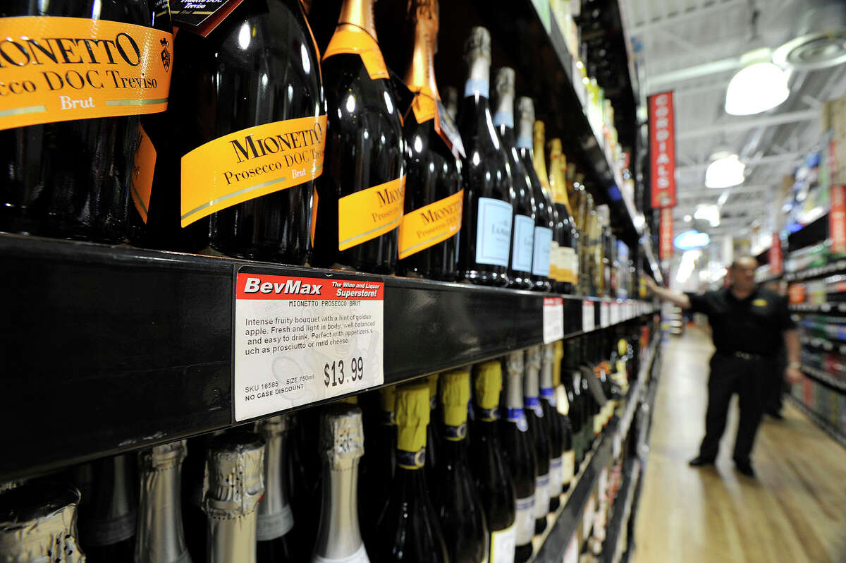 Bottles of Mionetto prosecco is on display at the BevMax liquor store in Stamford, Conn., on Wednesday, July 15, 2015. CEO Mike Berkoff says the current price is $13.99 but could be sold for $9.95 if there were no minimum price restrictions. The retail liquor chain has been fighting to eliminate the minimum pricing laws in the state.