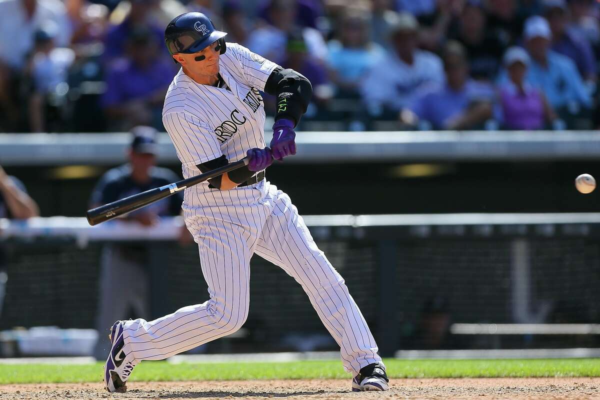 DENVER, CO - JULY 12: Troy Tulowitzki #2 of the Colorado Rockies hits a three run home run during the sixth inning against the Atlanta Braves at Coors Field on July 12, 2015 in Denver, Colorado. (Photo by Justin Edmonds/Getty Images)
