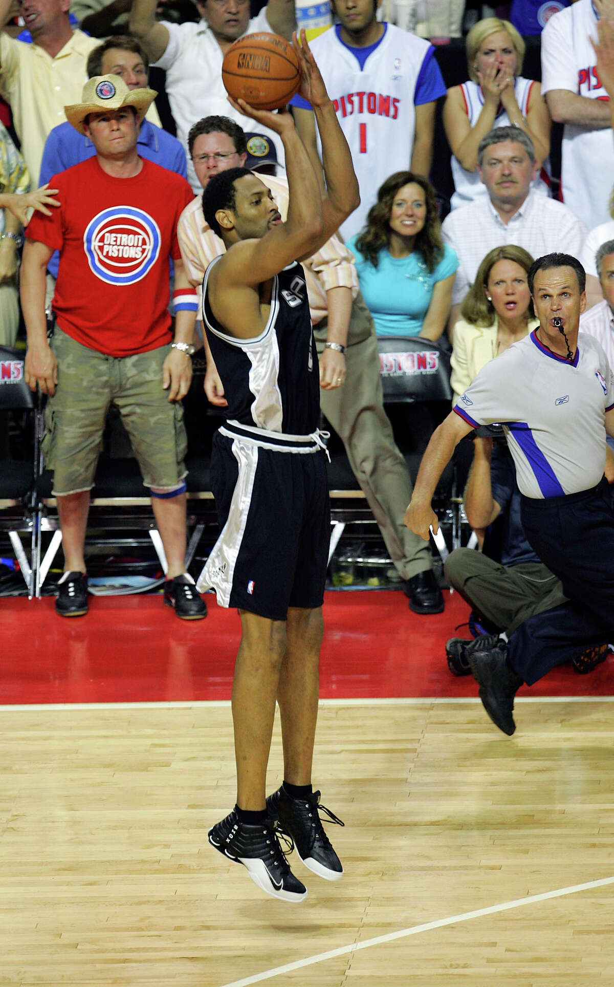 Spurs’ Robert Horry gets set to launch the game-winning 3-point shot during overtime of Game 5 of the NBA Finals against the Detroit Pistons at The Palace of Auburn Hills on June 19, 2005.