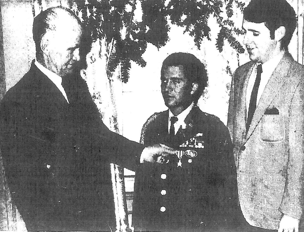 Lt. Richard Flaherty posed in this Dec. 18, 1968, Stamford Advocate photo with his father, Walter, left, and brother, Walter Jr., right. Flaherty had just returned from Vietnam, where he was awarded the Silver Star for combat valor. He was struck and killed by a car in May 2015. A Florida man is making a documentary about Flaherty's life.
