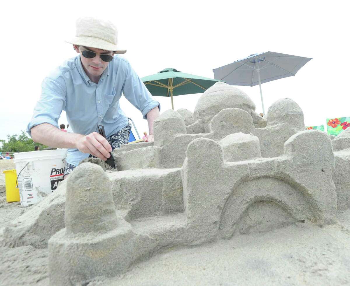 Teek Eaton-Koch, of Greenwich, constructs a sand castle during the Greenwich Arts Council and the Town of Greenwich Department of Parks and Recreation's “Sandblast!” at Greenwich Point in 2014.