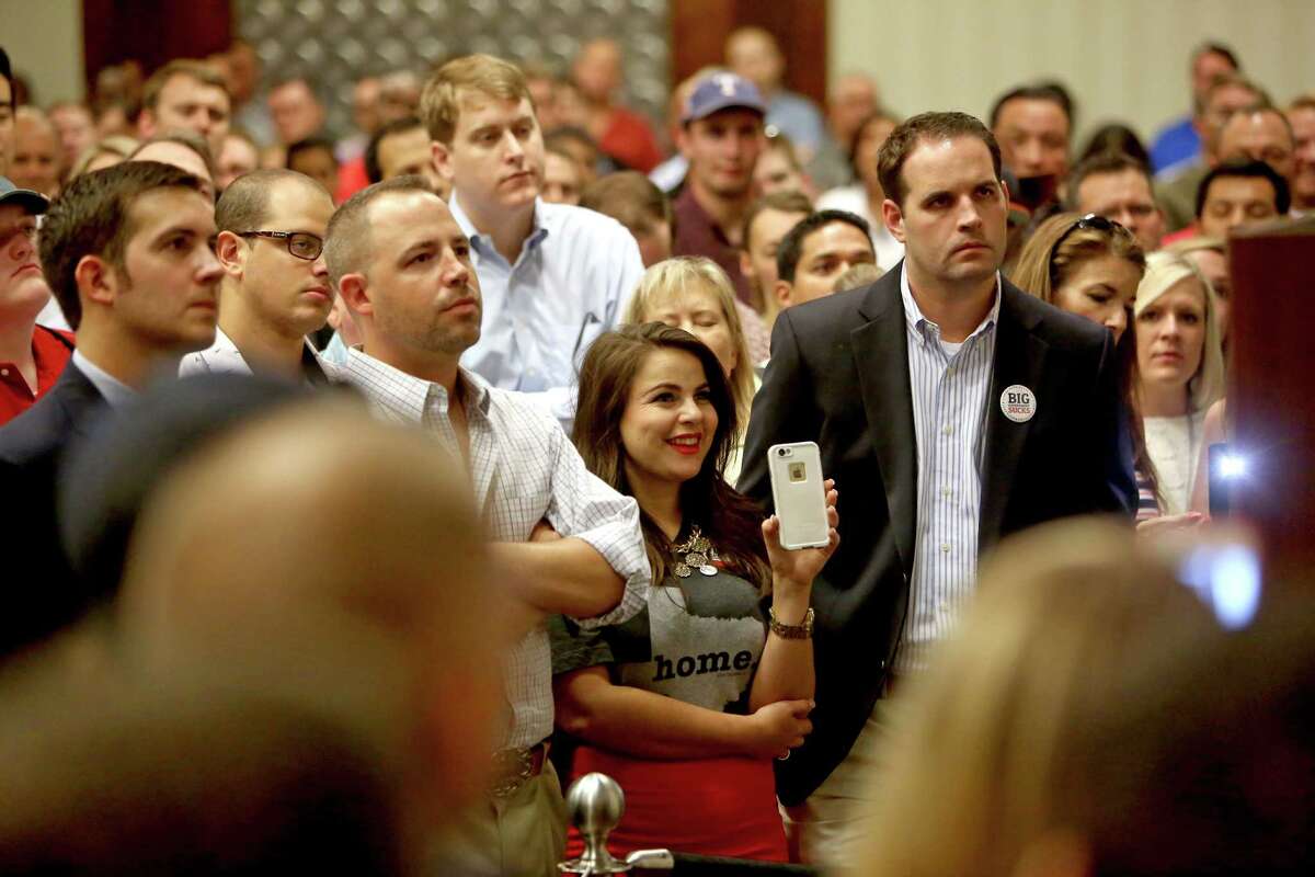 Bree Binder, center, ﻿is among the many young attendees showing their support on Friday for Sen. Rand Paul as he delivers a speech.﻿