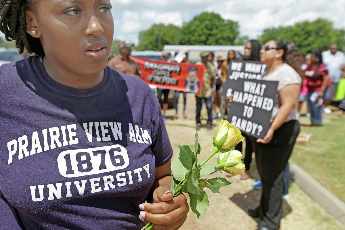 Prairie View A&M senior Toni Mayze﻿ waits ﻿for a protest march to begin ﻿Friday in Hempstead.
