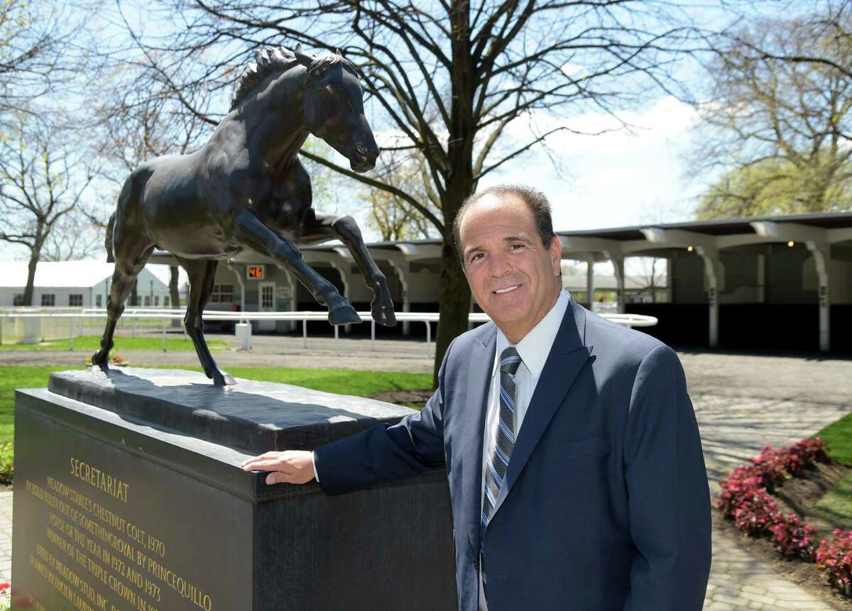 New York Racing Association, Chairman Anthony Bonomo stands in the paddock area of Belmont Park April 29. 2015, in Elmont, N.Y. Behind him is a statue of Secretariat the thoroughbred who won a triple crown at Belmont in 1973. (Newsday / Audrey C. Tiernan)