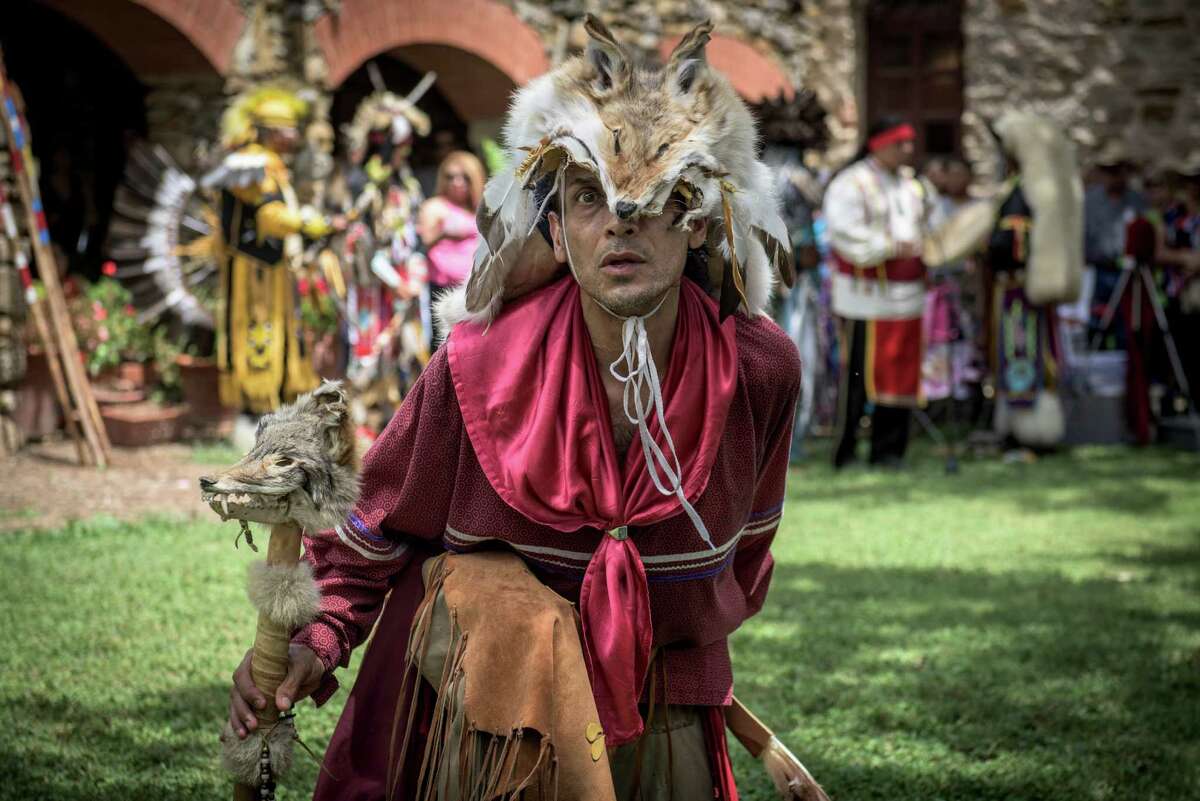 Local actor Jesse Borrego aka "Coyote Man" performs along with the American Indians in Texas Dance Theater during the 6th Annual Four Seasons Indian Market at Mission Espada on Saturday, July 18, 2015. The recent designation of the Missions of San Antonio as UNESCO World Heritage Sites is raising awareness of the indigenous peoples who were involved in the building of the missions and their subsequent histories.