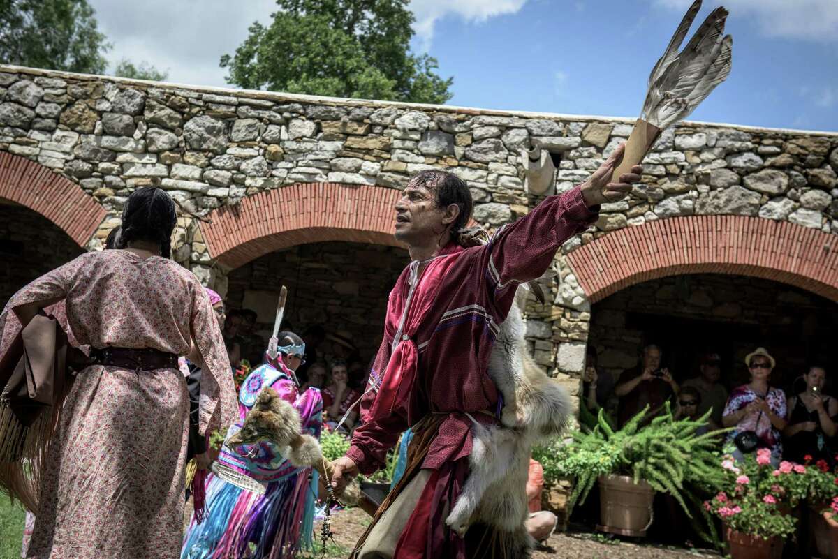 Actor Jesse Borrego, a Native American descendant, performs as “coyote man” with the Texas Dance Theater at the sixth annual Four Seasons Indian Market at Mission Espada. The festival was two weeks after the missions became a World Heritage Site.