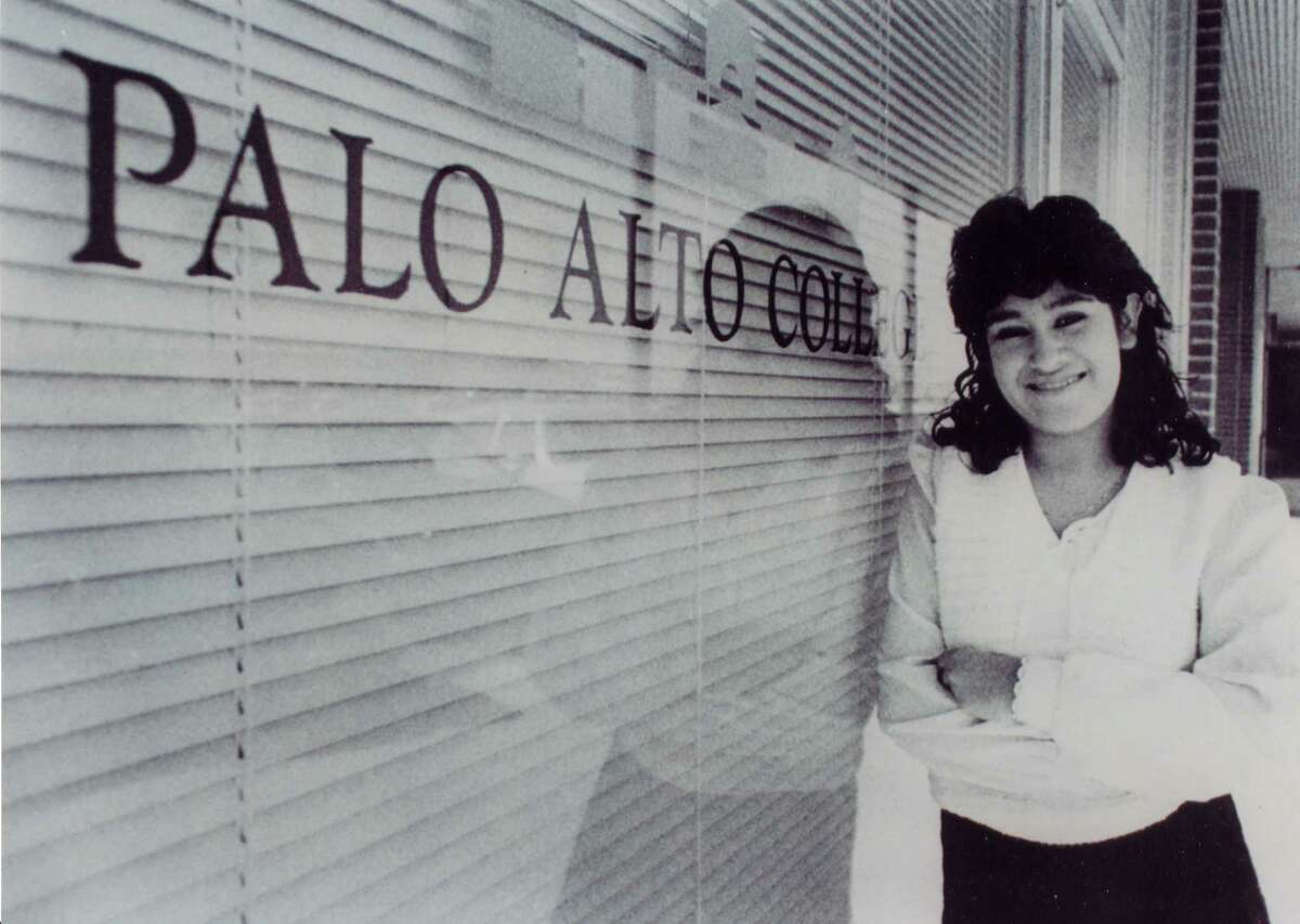 Elizabeth Aguilar-Villarreal, Palo Alto College’s first enrolled student, poses outside the College’s original administration office. Aguilar-Villarreal now serves as director of enrollment at Palo Alto College.