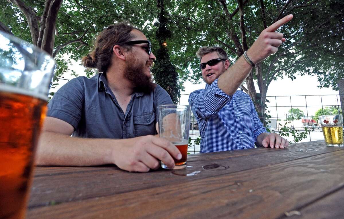 Wes Hardin, left, and Tyler Blount, right, talk beer during American Craft Beer Week at Luke's on Wednesday, May 16, 2013. cat5 file photo