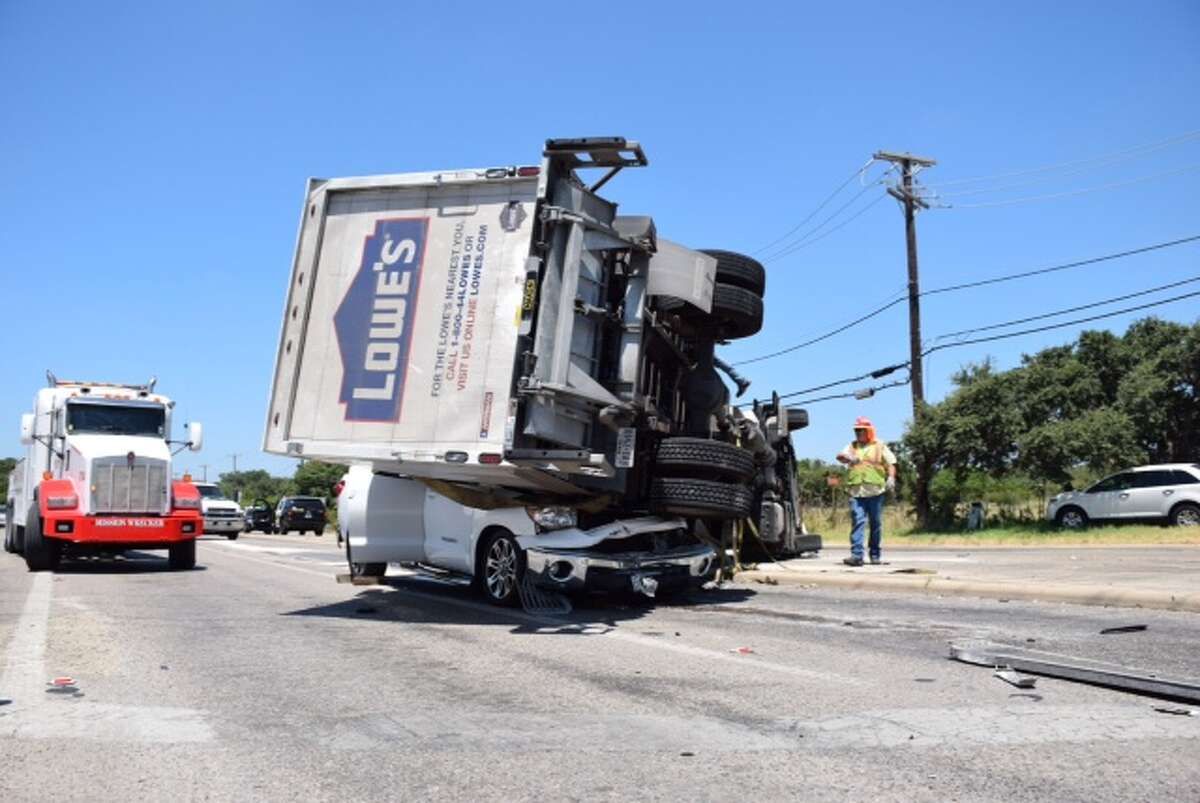 A man walked away with no major injuries after a big rig rolled over and landed on top of his Toyota Tundra pickup truck Tuesday, July 21, 2015 on the Northwest Side.