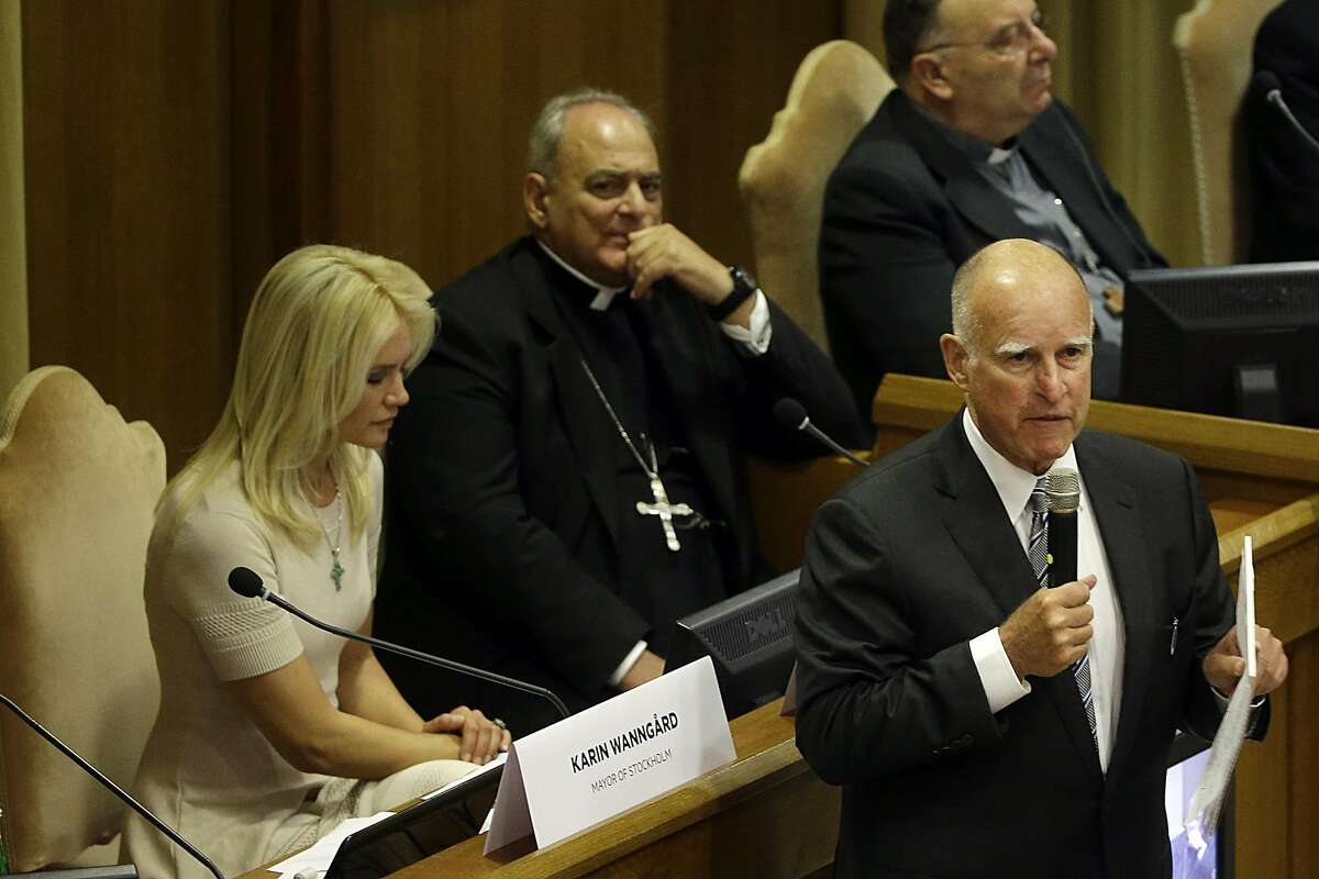 California Gov. Jerry Brown, right, delivers his speech in the Synod Hall as he attends a conference on Modern Slavery and Climate Change at the Vatican, Tuesday, July 21, 2015. Dozens of environmentally friendly mayors from around the world are meeting at the Vatican this week to bask in the star power of eco-Pope Francis and commit to reducing global warming and helping the urban poor deal with its effects. (AP Photo/Gregorio Borgia)