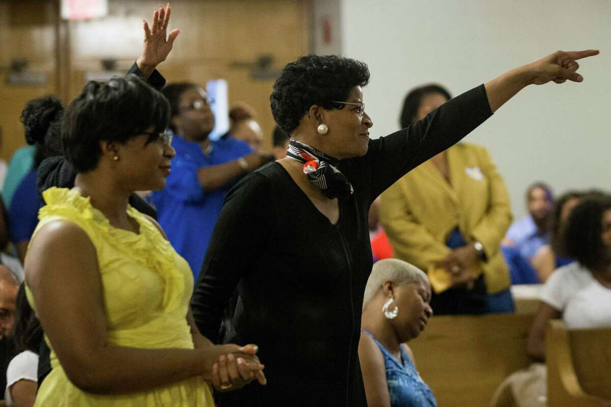Geneva Reed-Veal, mother of Sandra Bland, center, reacts as her daughter is celebrated during a memorial service for Bland at All Faiths Chapel on the campus of Prairie View A&M University on Tuesday, July 21, 2015, in Houston. Bland, a 28-year-old African American woman, was arrested July 10, after being stopped by a Department of Public Safety trooper for failing to signal a lane change. A DPS spokesman said she was arrested after becoming "uncooperative" and kicking the trooper. Three days later, she was found hanging from a ligature in her cell made from a plastic bag.