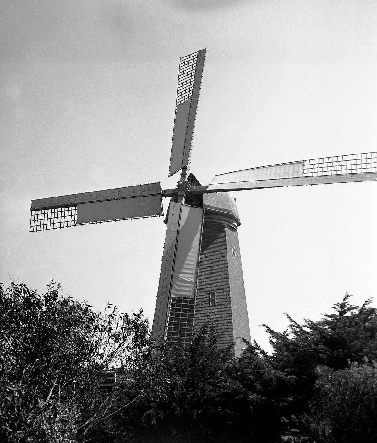 In this May 30, 1936 file photo, the historic landmark Murphy Windmill stands in Golden Gate Park in San Francisco. The windmill's 68-ton copper dome was placed back on top of the structure on Monday, Sept. 12, 2011, after undergoing nearly a decade of restoration.